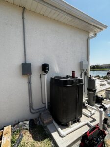 Outdoor pool equipment with electrical conduits and wiring installed by Phoenix Electric, Inc. in Cape Coral, FL