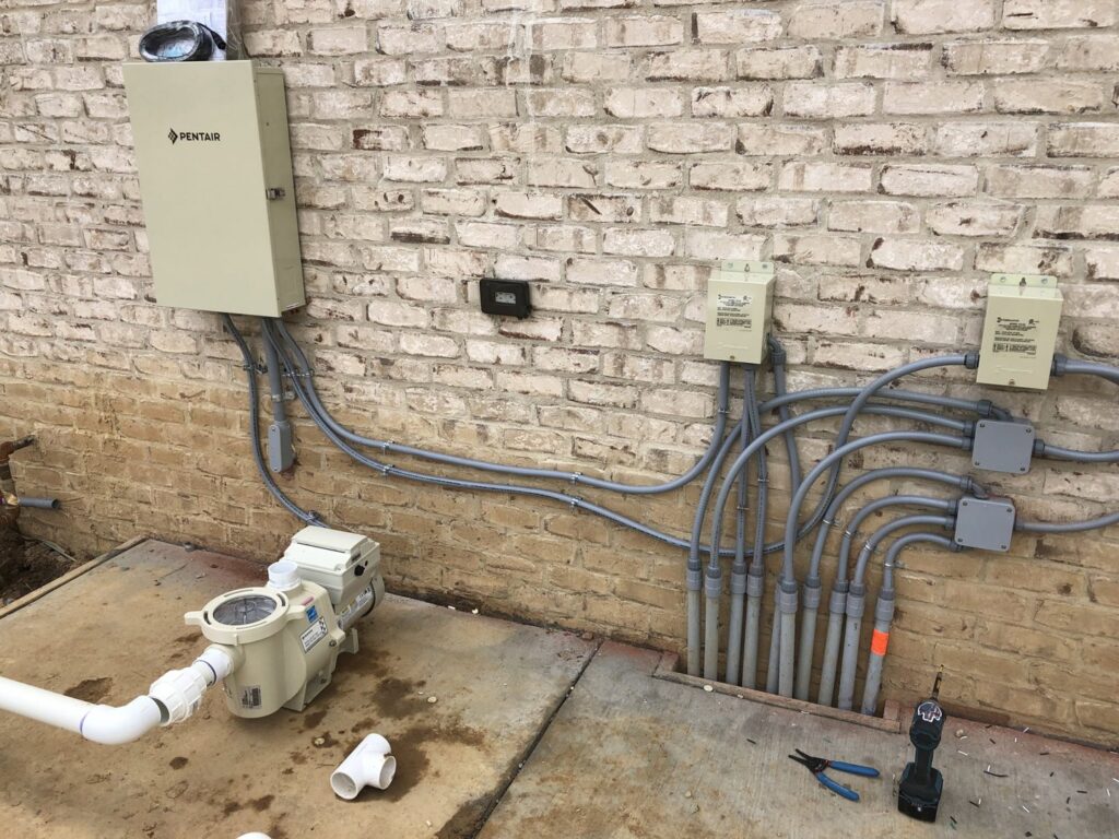Outdoor electrical wiring and control boxes for pool equipment installed by TCB Electric LLC in Elizabethtown, KY.