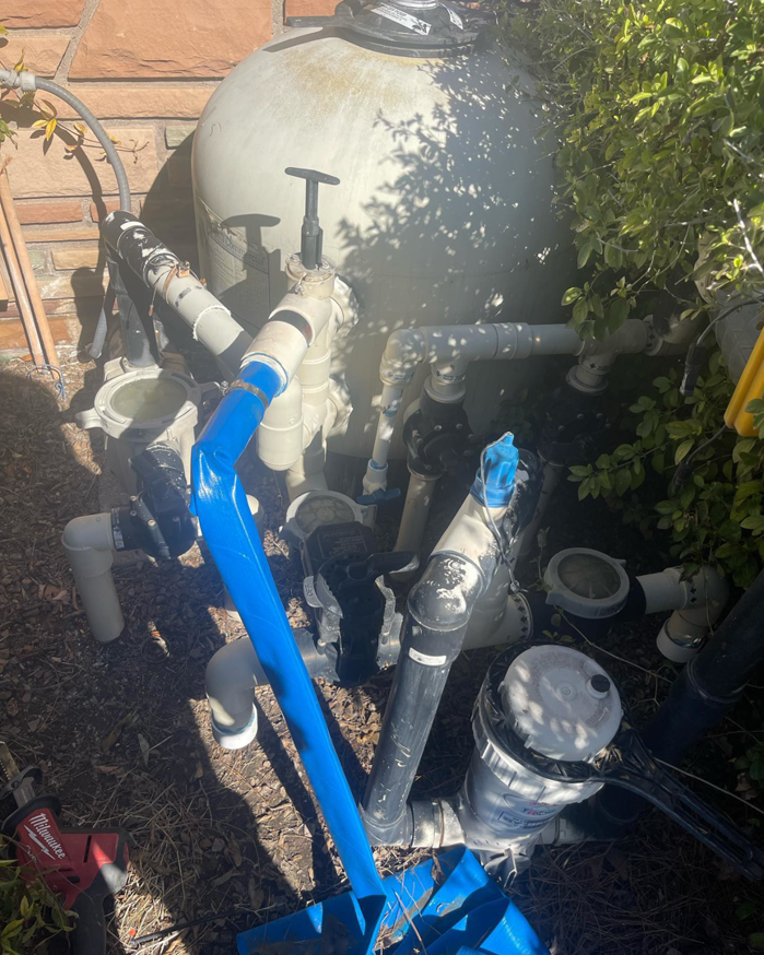 Complex pool equipment, including filters and pumps, installed or being repaired by Prime Pool Care in Satellite Beach, FL.