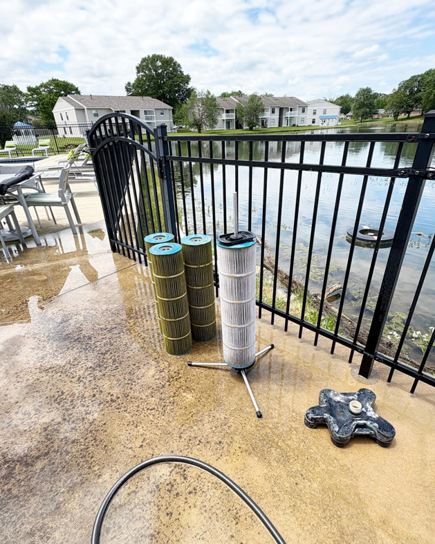 Dirty and clean pool filter cartridges being serviced by Pool Maid Pro in Decatur, AL.
