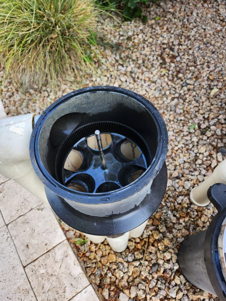 Close-up of a pool filter being cleaned and maintained by Blue Square Manufacturing, LLC in Chandler, AZ.