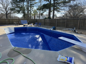 New pool liner installation with chemical bags on site by Pipeline Pools Inc. in Virginia Beach, VA.