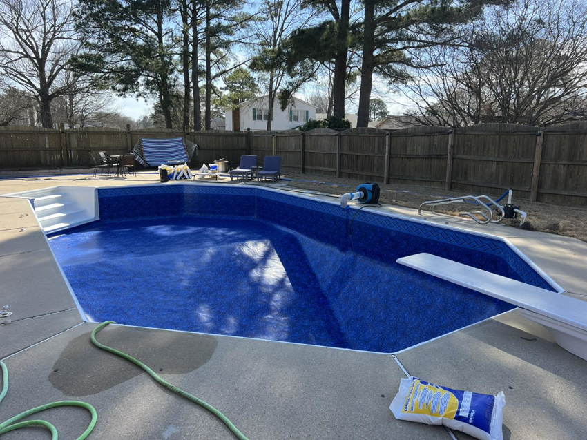 New pool liner installation with chemical bags on site by Pipeline Pools Inc. in Virginia Beach, VA.