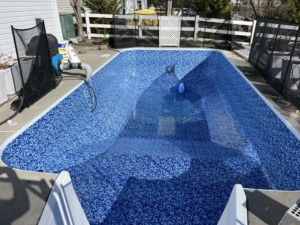 A residential pool undergoing liner replacement and maintenance by Pipeline Pools Inc. in Virginia Beach, VA.