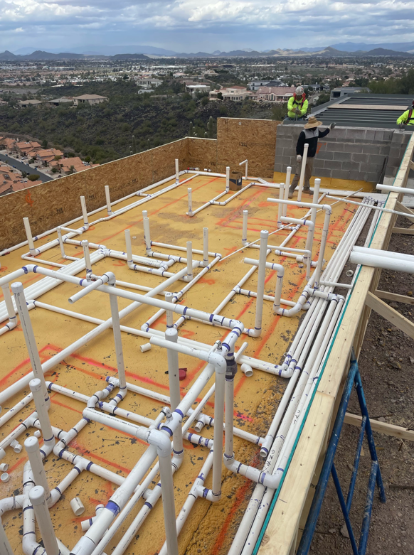 Pool plumbing installation in progress at a construction site by SoCal Pool Construction LLC in Scottsdale, AZ.
