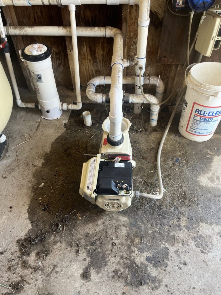 A pool pump and associated plumbing, indicating repair or maintenance work by Good Guy Pool Service in Moreno Valley, CA.