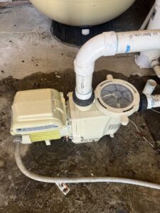 A pool pump and plumbing system, indicating maintenance or repair work by Good Guy Pool Service in Moreno Valley, CA.