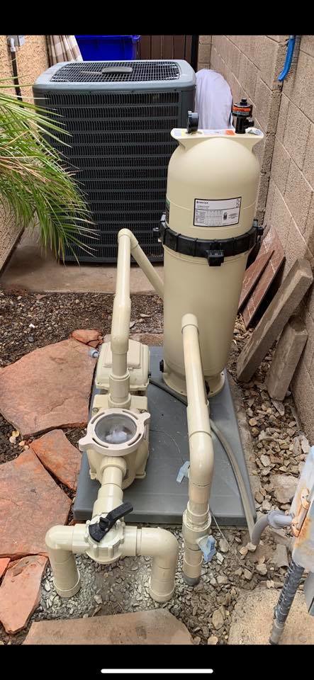 Close-up of pool pump and filter equipment, representing the technical aspects of pool cleaning and maintenance by Space Ranger Pools in Gilbert, AZ.