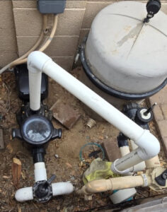 A pool pump and filter system undergoing repair or maintenance by Cruz pool service and repair in Lees Summit, MO
