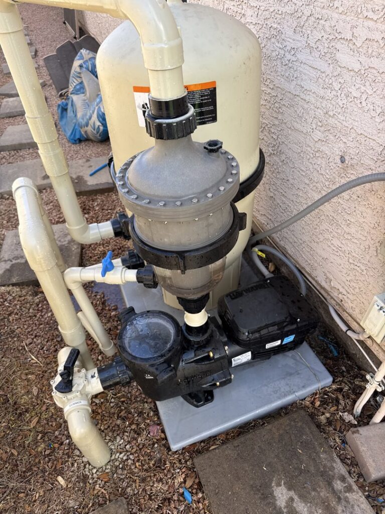 A residential pool pump and filter system, indicating maintenance and repair services by Pool Rescuers LLC in Gilbert, AZ.