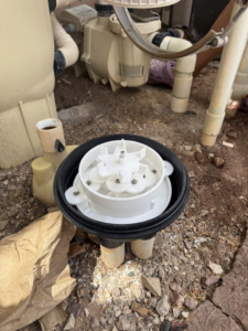 Close-up of internal gears and components of a pool pump or filter being repaired by Big Foot Pool Care in Buckeye, AZ