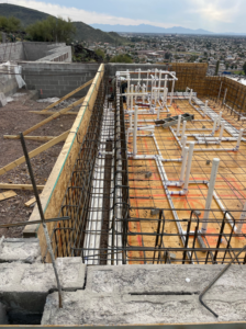 Rebar framing and plumbing installation for a new pool by SoCal Pool Construction LLC in Scottsdale, AZ.