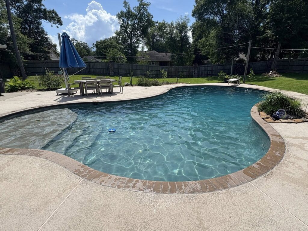 A pool cleaning robot at work in a sparkling clean pool, a service offered by Gayle Force Pools in Lake Charles, LA