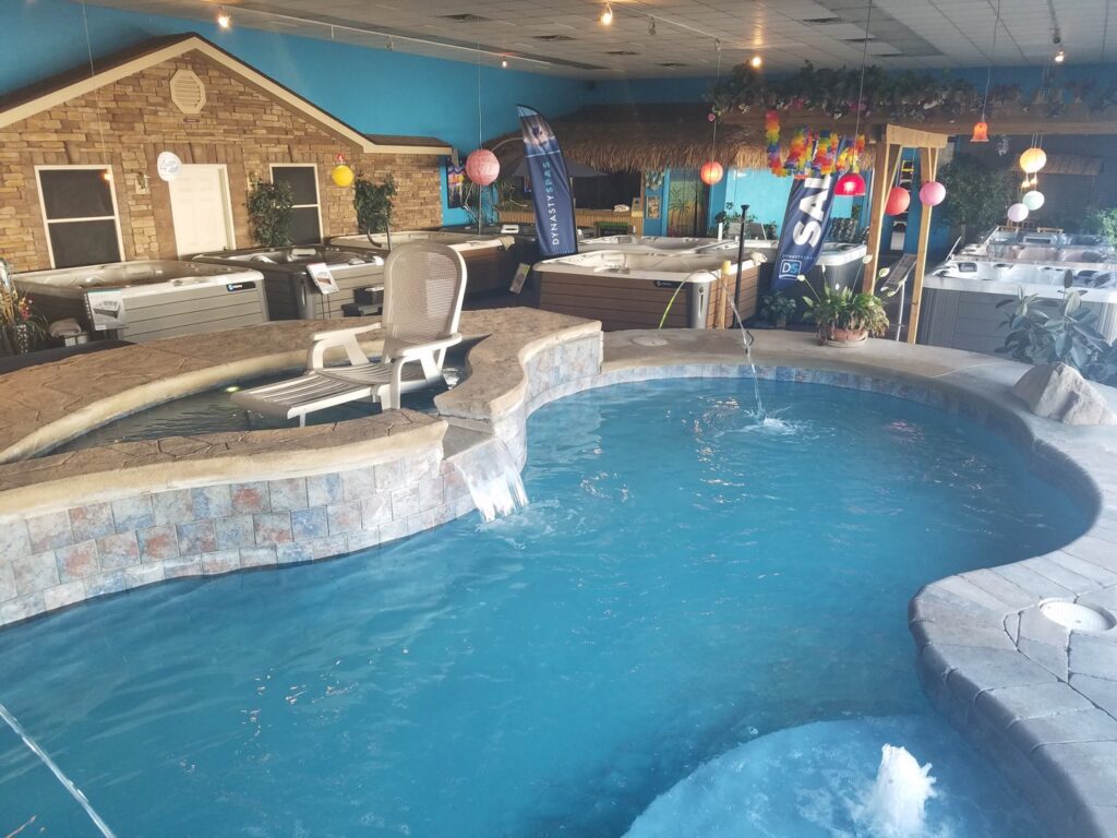 An indoor pool and spa showroom display at Firemaster in Oklahoma City, OK
