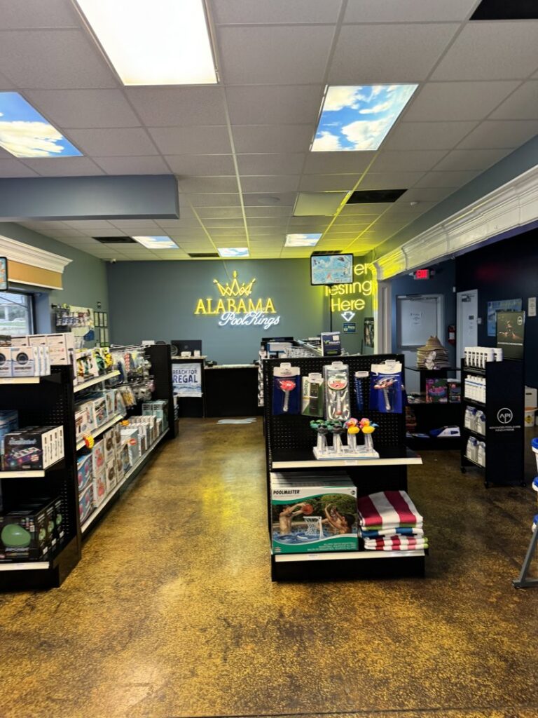 Interior view of the Alabama Pool Kings store in Madison, AL, displaying various pool cleaning supplies and accessories.
