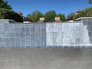 Before and after view of pool tile cleaning, showing sparkling clean tiles on the left and stained tiles on the right by AZ Pool Love in Mesa, AZ
