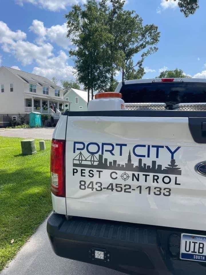 A white Port City Pest Control truck with the company logo and phone number in Summerville, SC.