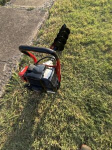 A power auger, a tool used for installing pest control devices or bait stations by Drapers Pest Management in Fort Worth, TX.