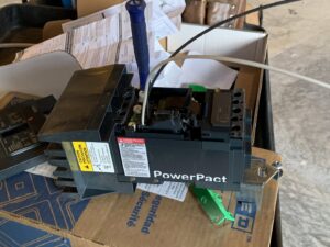A PowerPact circuit breaker being worked on by an electrician from Oak Electric LLC in Waterford, MI.