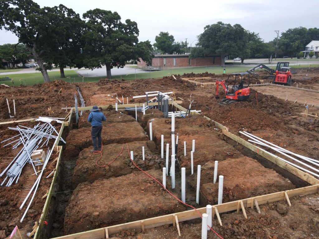 A construction site prepared for pre-construction termite treatment by D' Bug Man Pest Control in Arlington, TX.