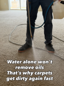 A technician pre-treating a carpet with a cleaning solution before deep cleaning by Bullseye Carpet & Upholstery Cleaning in Boise, ID.