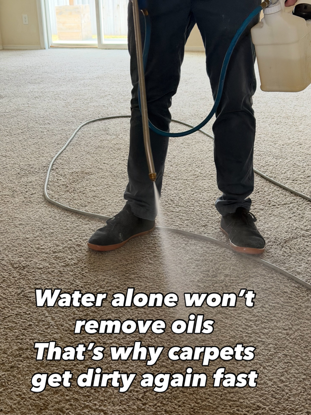 A technician pre-treating a carpet with a cleaning solution before deep cleaning by Bullseye Carpet & Upholstery Cleaning in Boise, ID.