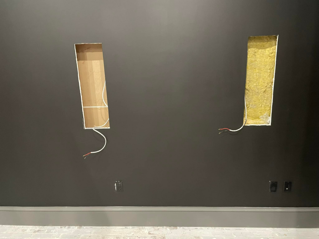 Pre-wiring for wall-mounted components and electrical outlets by Heritage Electric in Bluffton, SC.