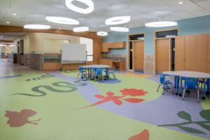 A vibrant preschool classroom with custom-designed resilient flooring installed by Capital Carpet & Flooring Specialists in Wilmington, MA