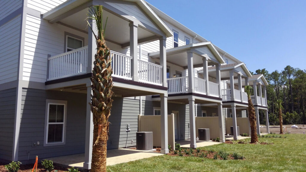 Small privacy fences installed in the backyards of townhouses by Best Fence and Rail in Jacksonville, FL.