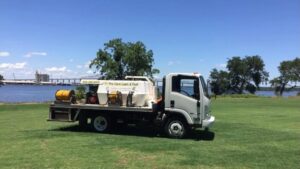 A Pro Care Lawn and Pest service truck with pest control and lawn care equipment in Jacksonville, FL.