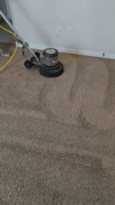 A professional floor buffer cleaning a carpet, leaving distinct clean lines, by Carpet Care Express in Garland, TX
