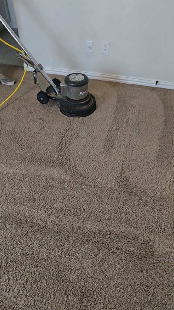 A professional floor buffer cleaning a carpet, leaving distinct clean lines, by Carpet Care Express in Garland, TX