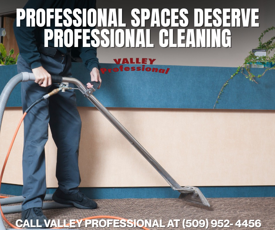 A professional using a carpet cleaning wand to clean a commercial carpet, showcasing services by Valley Professional Carpet & Upholstery Cleaning in Yakima, WA.
