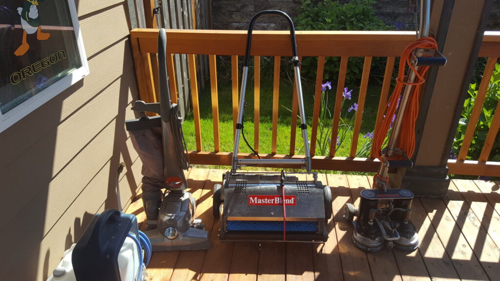 Various professional carpet cleaning machines and equipment displayed by Howells Carpet Cleaning in Milwaukie, OR.