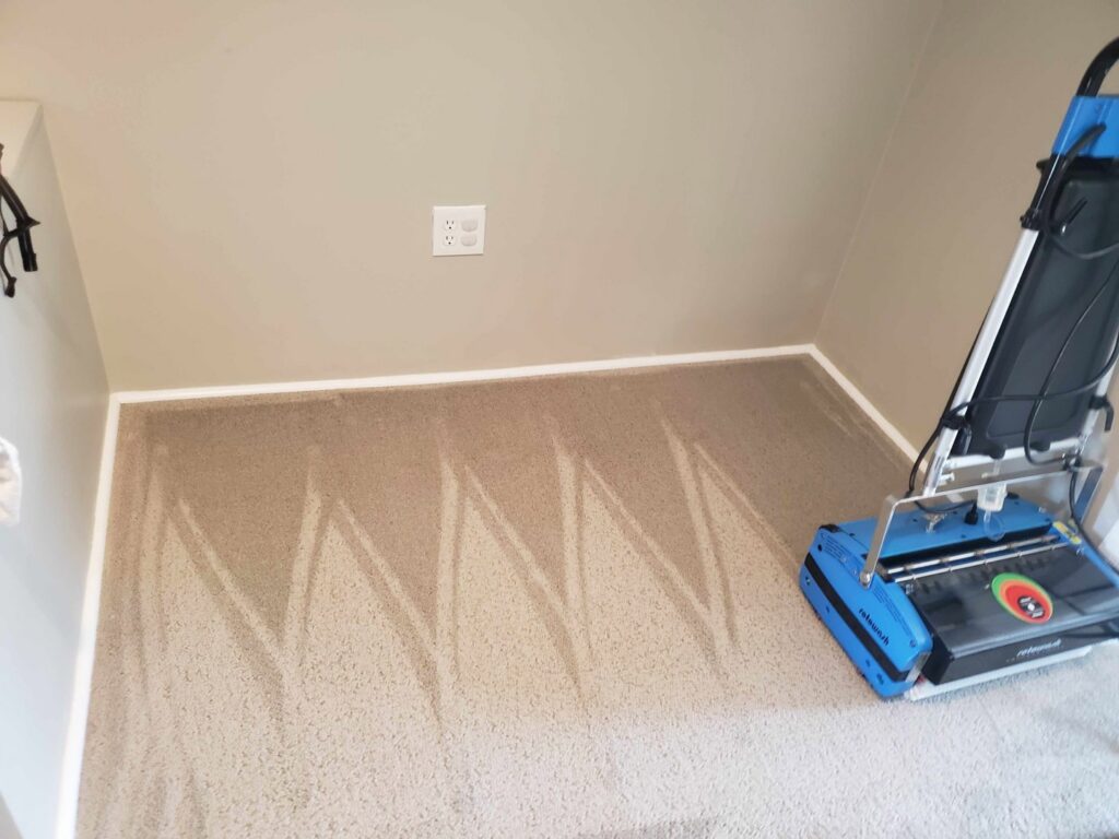 A professional carpet cleaning machine leaving clean lines on a carpet by A&g's carpet cleaning service in Vancouver, WA.