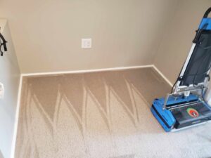 A professional carpet cleaning machine leaving clean lines on a carpet by A&g's carpet cleaning service in Vancouver, WA.