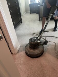 A professional using a carpet cleaning machine for deep cleaning by Superior Clean Carpet and Upholstery Care in Jacksonville, FL