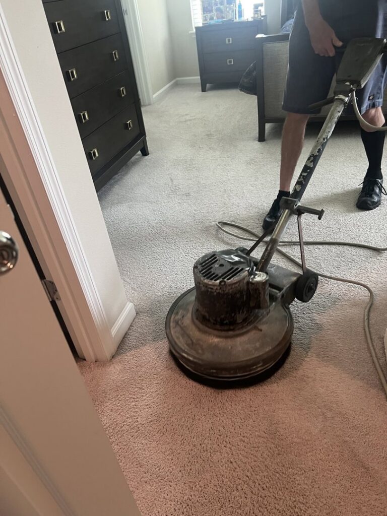 A professional using a carpet cleaning machine for deep cleaning by Superior Clean Carpet and Upholstery Care in Jacksonville, FL