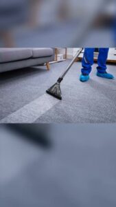 A professional cleaning a grey carpet with a cleaning wand by Ready2go Professional Carpet & Upholstery Cleaning in Boston, MA