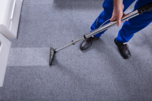 A professional technician performing carpet cleaning with specialized equipment for AAA Carpet Cleaning and Restoration in Springfield, MO