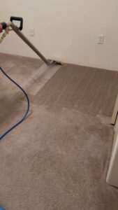 A professional carpet cleaning service in progress with a cleaning wand by Flooring Concepts Clean And Seal LLC in Tucson, AZ.