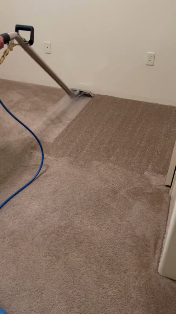 A professional carpet cleaning service in progress with a cleaning wand by Flooring Concepts Clean And Seal LLC in Tucson, AZ.