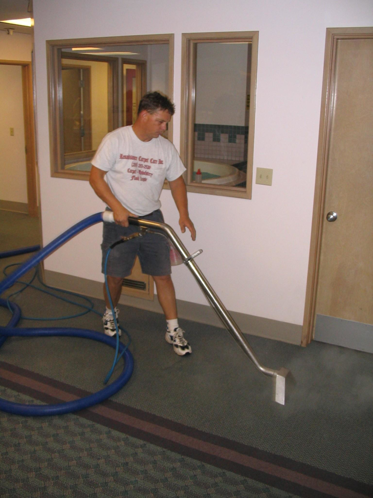 A Renaissance Carpet Care Inc professional performing a thorough carpet cleaning service in Mercer Island, WA.