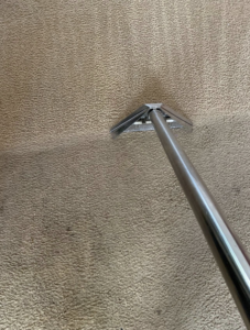 A close-up view of a professional carpet cleaning tool in action, demonstrating services by Capital City Floor Care LLC in Columbus, OH.