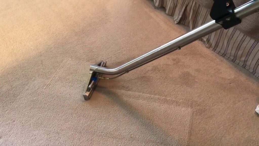 A professional carpet cleaning wand in action on a light-colored carpet by Zerorez Nashville, TN