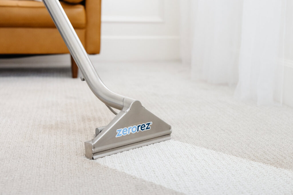 A Zerorez cleaning tool creating a clean strip on a carpet during a professional cleaning service in Naperville, IL, by Zerorez ChicagoLand.