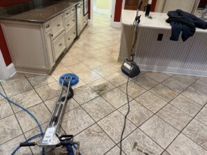Professional tile floor cleaning in a kitchen with two machines by Great Day Carpet & Tile Cleaning LLC Desoto in Olive Branch, MS.