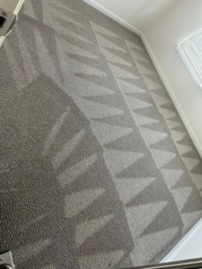 A professionally cleaned carpet with intricate vacuum patterns by Furns Total Carpet Care in Murfreesboro, TN.