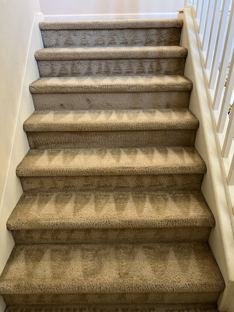 Professionally cleaned carpeted stairs with visible patterns by California Xtreme Steam in Sacramento, CA