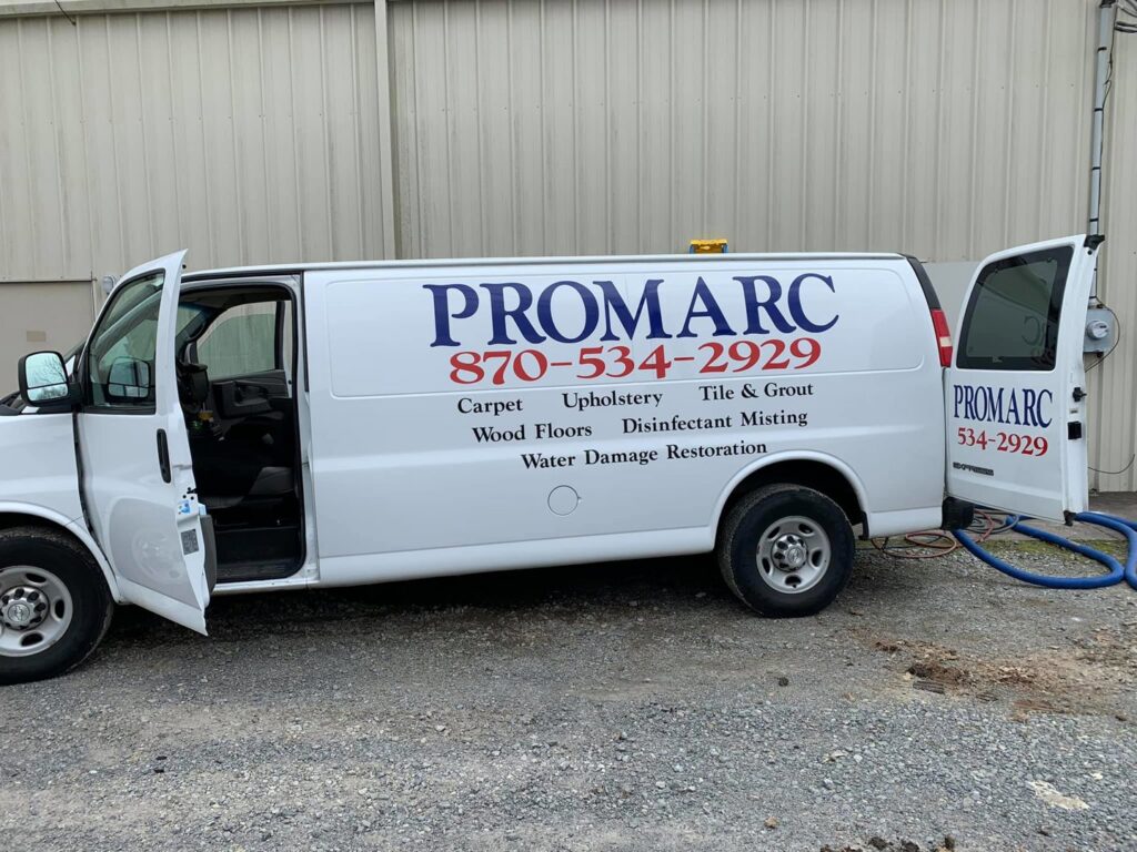 The Promarc Carpet Care service van with hoses extended, ready for a carpet cleaning job in Pine Bluff, AR.